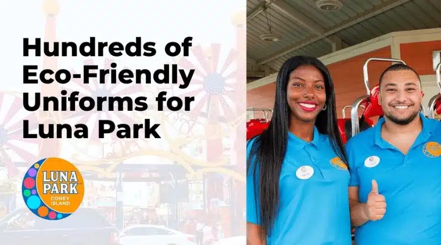 Two smiling staff in blue uniforms stand at Luna Park, Coney Island. Text reads: "Hundreds of Eco-Friendly Uniforms for Luna Park." Atmosphere is cheerful.