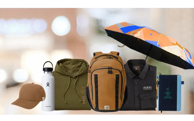 Tan cap, green hoodie, gray shirt, tan backpack, white bottle, blue notebook, colorful umbrella