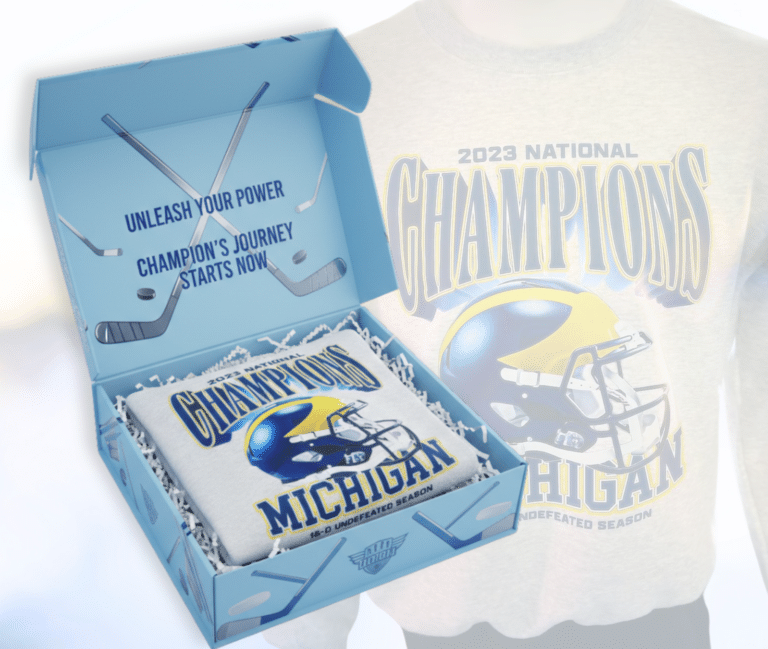 Custom Michigan Champions apparel packaged in branded box with “Unleash Your Power” interior message.