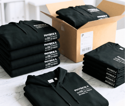 Stack of custom branded hoodies and T-shirts packed for employee onboarding kits