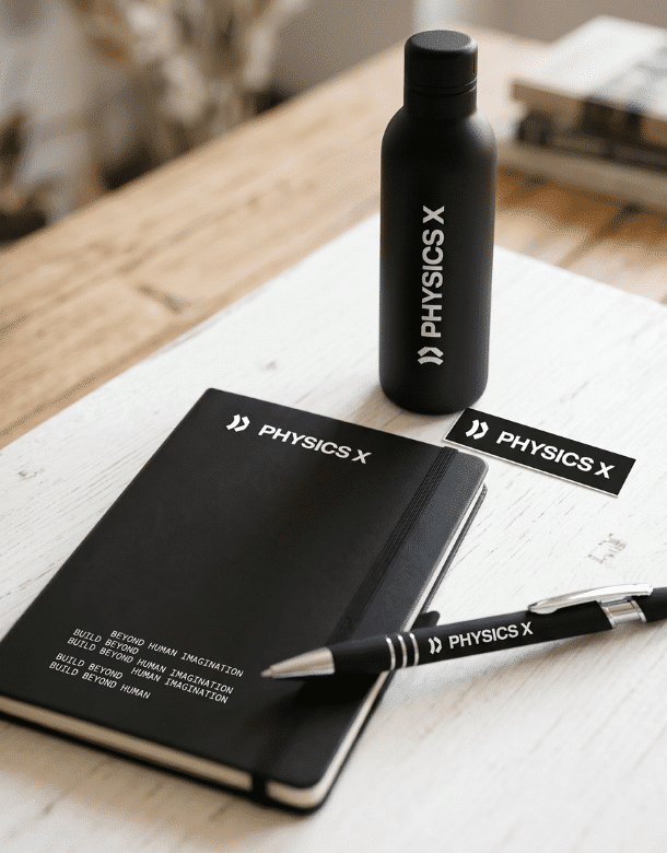 Branded notebook, water bottle, ballpen, and logo stickers displayed as part of a custom corporate promotional products collection.