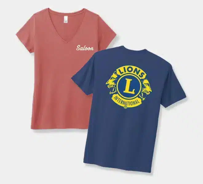 Two t-shirts, one pink with "Saloon" text and one blue with the Lions International logo.